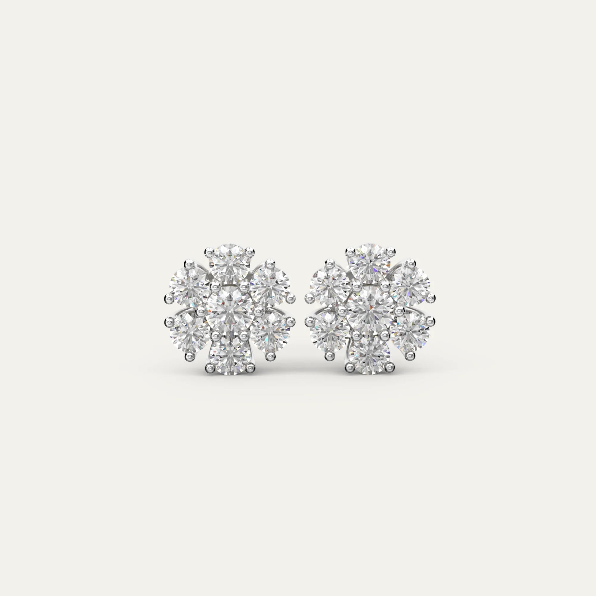 Goldmacher Calytrix sterling silver cluster earrings with round moissanite stones in a floral design