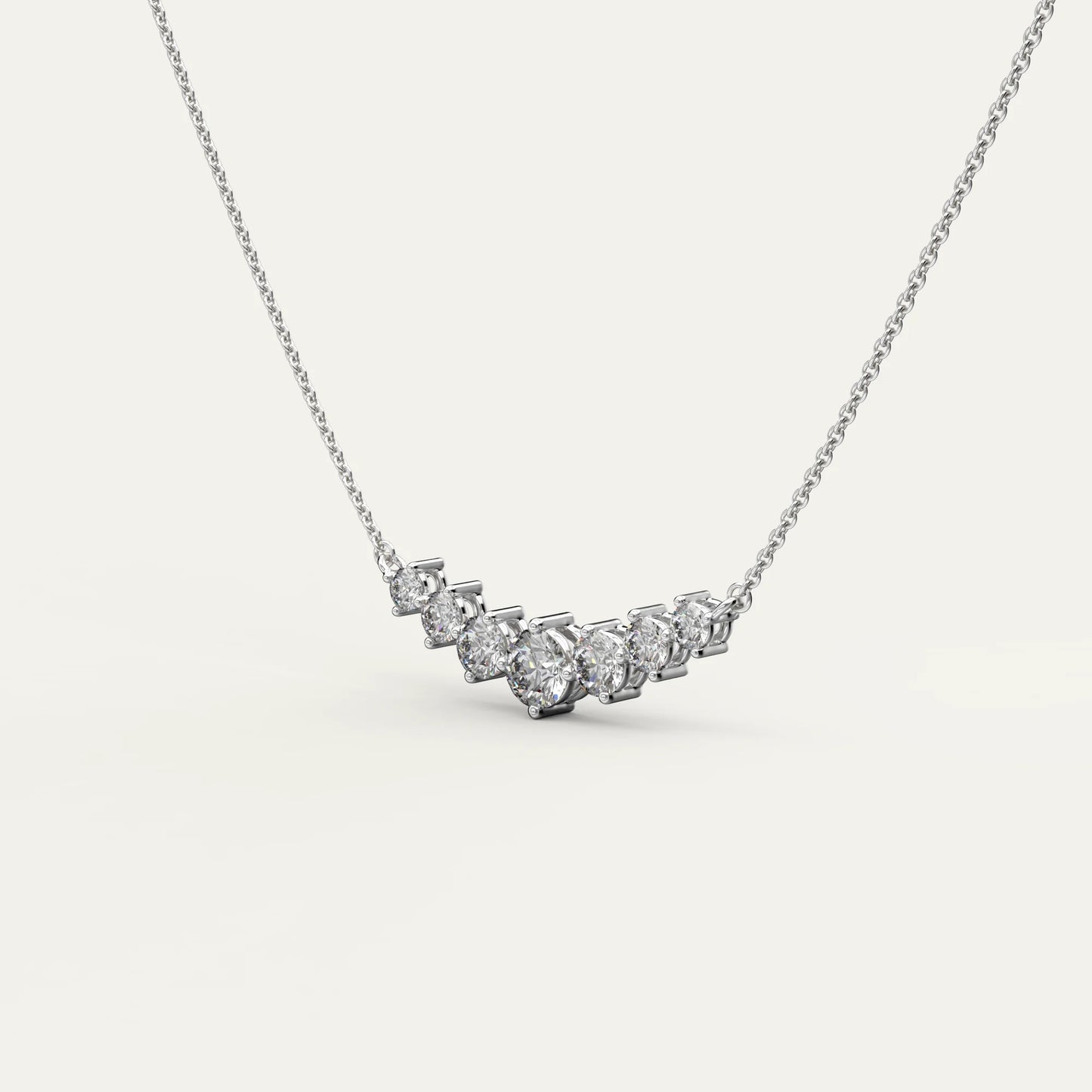 Goldmacher Felis 925 Silver Graduated Curved Necklace – 0.5ct Round Moissanite Stones for Layered Sparkle and Affordable Everyday Elegance.
