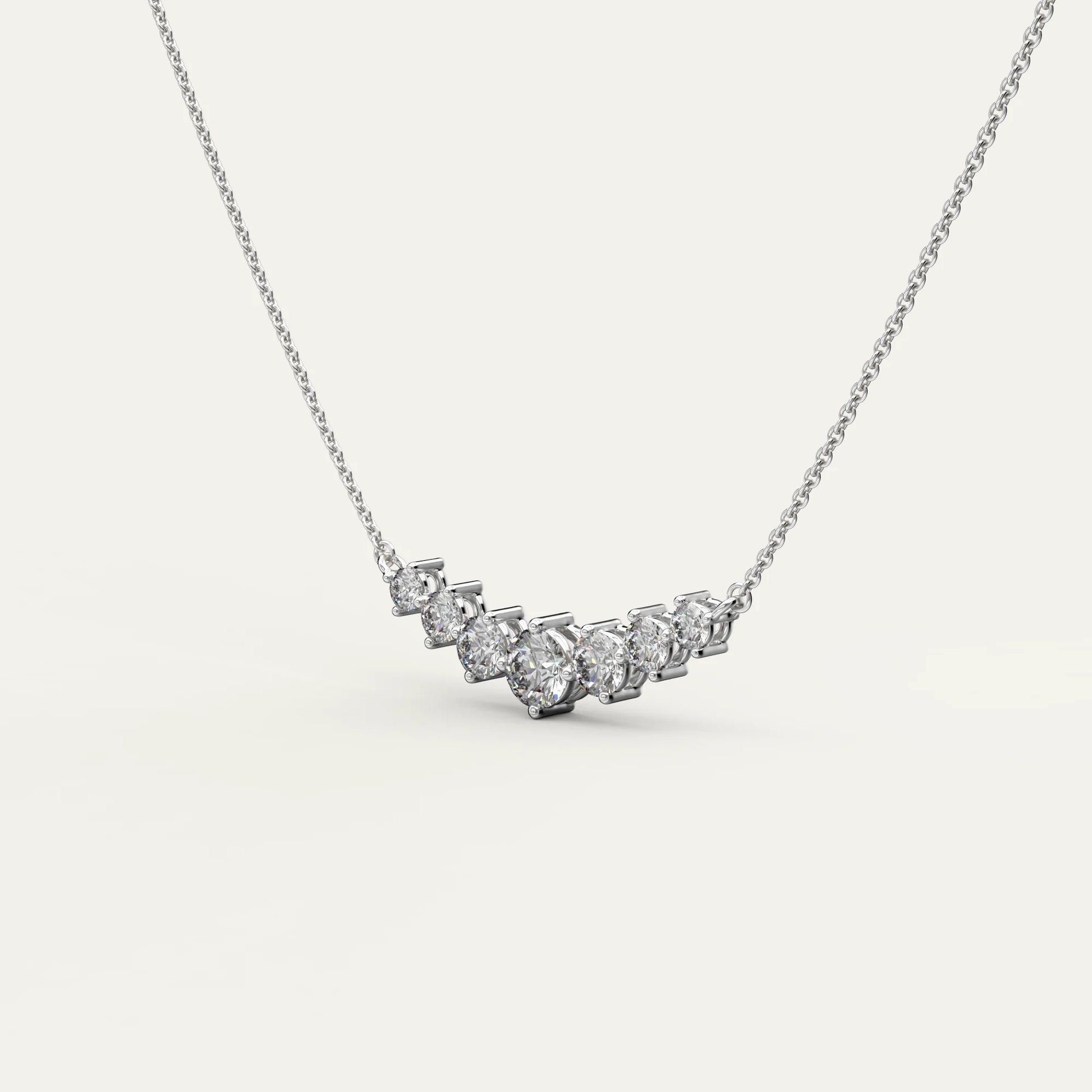Goldmacher Felis 925 Silver Graduated Curved Necklace – 0.5ct Round Moissanite Stones for Layered Sparkle and Affordable Everyday Elegance.