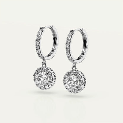 Goldmacher Pollux luxury earrings featuring 1 carat round-cut moissanite gemstone, halo accent, and polished 925 silver finish.